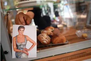  ??  ?? A PRINCESS DIANA postcard is seen inside the Cafe Diana in London earlier this month.