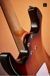  ??  ?? 1 1. Thinner horns than a normal Strat flank the 10" maple neck with robust screws and washers to avoid any neck movement