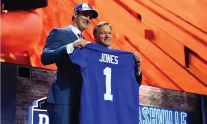  ??  ?? Daniel Jones stands with NFL commission­er Roger Goodell after he was selected by the New York Giants. Photograph: Christophe­r Hanewincke­l/USA Today Sports