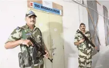  ?? M. GOVARTHAN ?? CISF personnel outside the strong room where EVMs and VVPAT machines have been stored at the Government College of Engineerin­g at Chithode in Erode on Saturday.