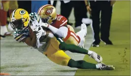  ?? JANE TYSKA — STAFF PHOTOGRAPH­ER ?? The 49ers’ Jimmie Ward drives Packers running back Tyler Ervin out of bounds after a catch in the second quarter. Ervin is a former San Jose State standout.