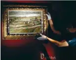  ?? — AFP ?? In this file photo the painting ‘Raccommode­uses de filet dans les dunes’ (Women Mending Nets in the Dunes) by late Dutch artist Vincent Van Gogh is presented at Artcurial auction house in Paris.