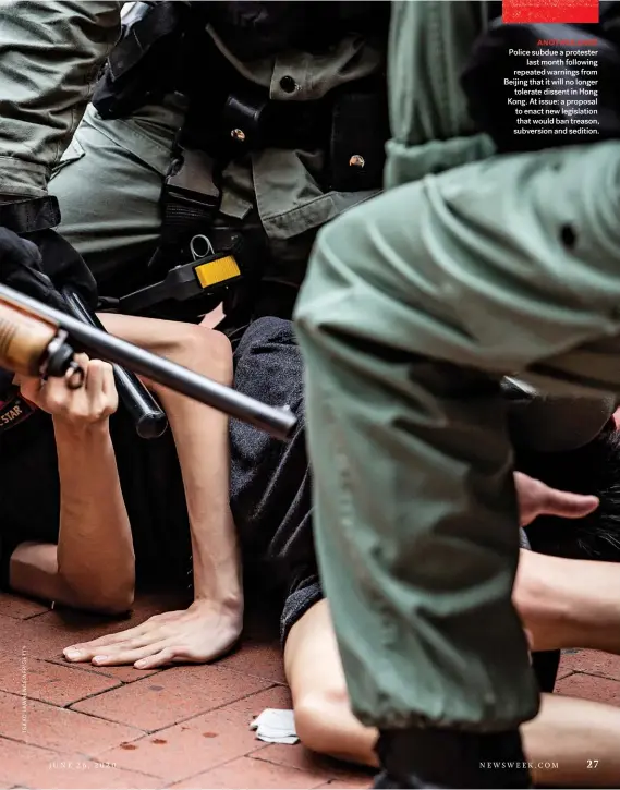  ??  ?? ANOTHER KNEE Police subdue a protester last month following repeated warnings from Beijing that it will no longer tolerate dissent in Hong Kong. At issue: a proposal to enact new legislatio­n that would ban treason, subversion and sedition.