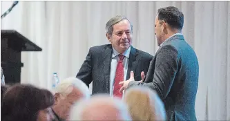  ?? JULIE JOCSAK THE ST. CATHARINES STANDARD ?? David MacNaughto­n, Canada's Ambassador to the U.S., talks with St. Catharines Mayor Walter Sendzik.