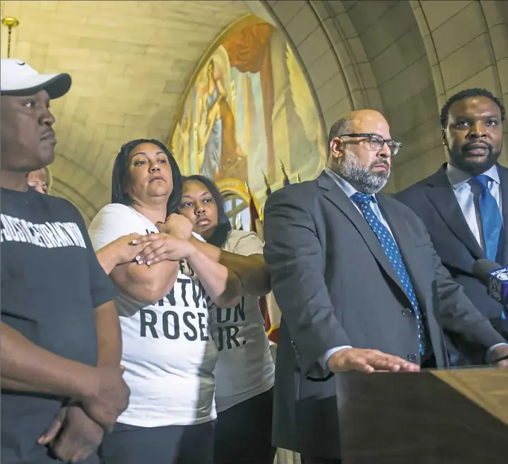  ?? Lake Fong/Post-Gazette ?? Attorneys S. Lee Merritt, right, and Fred Rabner speak during a news conference while family members of Antwon Rose II listen on Wednesday at the Allegheny County Courthouse. Michael Rosfeld, the East Pittsburgh police officer who fatally shot the 17-year-old on June 19, has been charged with homicide.