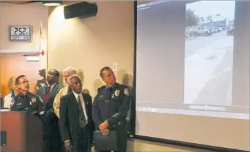  ?? Photograph­s by Mark Boster Los Angeles Times ?? EL CAJON Police Chief Jeff Davis, left, and other officials view video footage of the fatal police shooting of Alfred Olango. Davis said the video was released in hopes of giving the public a better sense of what happened.