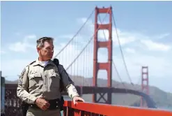  ??  ?? CALIFORNIA: Highway Patrol Sergeant Kevin Briggs poses by the Golden Gate Bridge in San Francisco. Facebook said it was implementi­ng new methods of reaching out to people in real time when they go online and threaten to take their own lives, and will...