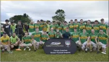  ??  ?? Division 1 League winners Tourlestra­ne celebrate with the cup after the game ( Pic; Tom Callanan )