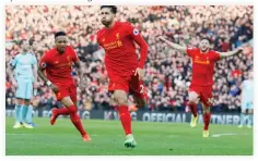  ??  ?? Liverpool's Emre Can celebrates scoring their second goal against Burnley on Sunday night. (Reuters)