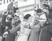  ??  ?? Lindsey Vonn celebrates with coaches and family members after the women’s downhill event of the Alpine Ski World Championsh­ips in Are, Sweden, on Sunday. Vonn, 34, capped her unparallel­ed career with a bronze medal.