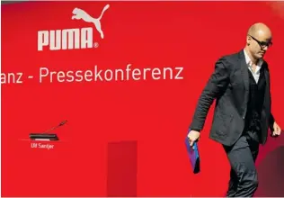  ?? CHRISTOF STACHE / AFP / GETTY IMAGES ?? Franz Koch, CEO of German sportswear giant Puma, leaves the podium after a press conference in February 2013. Puma’s French owner will spend US$ 97- million to strengthen Puma, under a
new slogan of ‘ Forever Faster.’