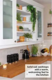  ?? ?? Solid oak worktops
add a warm, welcoming feel to
the kitchen