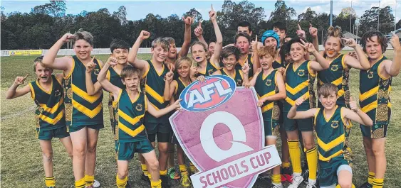  ??  ?? Currumbin players celebrate their win in the AFLQ Schools Cup SEQ South boys final and (below) the champion Hillcrest Christian College girls team.