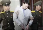  ?? JON CHOL JIN — THE ASSOCIATED PRESS ?? American student Otto Warmbier, center, is escorted at the Supreme Court in Pyongyang, North Korea.