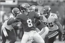  ?? BILL KOSTROUN/AP PHOTO ?? New York Giants quarterbac­k Daniel Jones (8) passes against the Minnesota Vikings during Sunday’s game at East Rutherford, N.J.