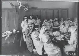  ?? EDWARD “DOC” ROGERS — OAKLAND TRIBUNE ?? Volunteers from the Piedmont Chapter of the Red Cross create masks during the Spanish Flu pandemic.