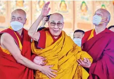  ?? — AFP file photo ?? Dalai Lama waves during his first day of a teaching session at the Kalachakra Ground in Bodhgaya on December 29, 2022. The Dalai Lama, the charismati­c Buddhist spiritual leader celebrated worldwide for his tireless campaign for greater autonomy for his Tibetan homeland, has been a thorn in China’s side for decades.