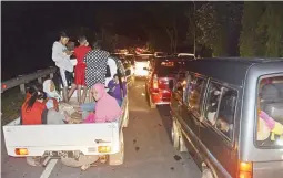  ??  ?? MAD SCRAMBLE – Traffic is at a standstill as people try to reach higher ground amid fears of a tsunami, following an earthquake in Cilacap, Central Java, Indonesia, Saturday. (AP)