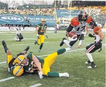  ?? JASON FRANSON THE CANADIAN PRESS FILE PHOTO ?? In this Oct. 12, 2019, photo, B.C. Lions’ Ryan Lankford leaps past Eskimos defenders in Edmonton. Answers are sought by teams and players alike as the Canadian Football League struggles for its very survival due to the COVID-19 pandemic.