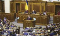  ?? - ONA ?? ADDRESS TO PARLIAMENT: Monday’s vote in parliament came after an emotional address by President Petro Poroshenko, who promised not to restrict basic freedoms.