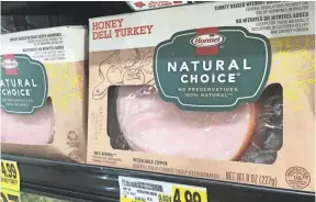  ?? PHOTOS BY CHRISTOPHE­R DOERING, USA TODAY ?? On this Hormel turkey package, the largest words are “Natural Choice.” Federal officials might be ready to define what “natural” means in regard to food.