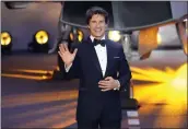  ?? ALBERTO PEZZALI — THE ASSOCIATED PRESS ?? “Top Gun Maverick” star Tom Cruise says hello at the UK premiere at a central London cinema on May 19.
