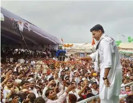  ?? — PTI ?? Rajasthan Congress chief Sachin Pilot greets his supporters during “Sankalp rally” in Karauli on Tuesday.