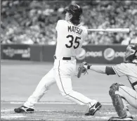  ?? By Jeff Griffith, US Presswire ?? Birthday present: The Rays’ Hideki Matsui hits an RBI single in the first inning against the Mets on Tuesday.