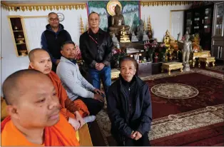  ?? PHOTOS BY DAI SUGANO — STAFF PHOTOGRAPH­ER ?? Khmer Kampuchea Krom Buddhist Associatio­n members Victor Thach, from right, Mora Thach, Phuong Thach and Voeng Thach; and Buddhist monks Saduol Son, far left, and Tay Thach gather at the main hall of the Khmer Kampuchea Krom Buddhist temple in San Jose. They say they have outgrown the facility and seek city approval for a new site.