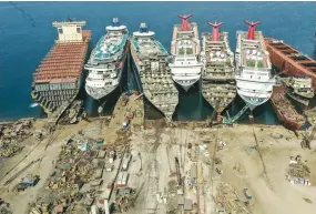  ?? ( Umit Bektas/ Reuters) ?? A DRONE IMAGE shows decommissi­oned cruise ships being dismantled at Aliaga shipbreaki­ng yard in the Aegean port city of Izmir, western Turkey, earlier this month.