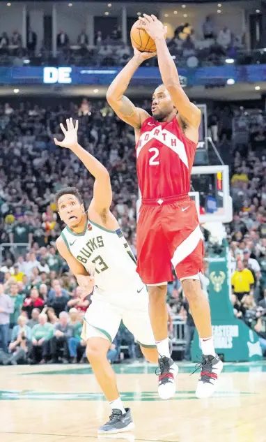  ?? AP ?? Toronto Raptors’ Kawhi Leonard (right) shoots in front of Milwaukee Bucks’ Malcolm Brogdon during the second half of Game 5 of the NBA Eastern Conference basketball play-off finals on Thursday, May 23, 2019, in Milwaukee. The Raptors won 105-99 to take a 3-2 lead in the series.