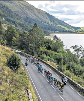  ??  ?? Spectacula­r view: The Tour of Britain riders pass Thirlmere reservoir yesterday