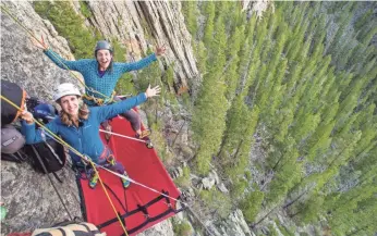  ?? PHOTOS BY JIM HOBART ?? Author Sarah Sekula, foreground, and Roz Reynolds perch on their cliffside campsite. Sekula claims this bucket-list adventure is something anyone can do — scaredy-cat or not.