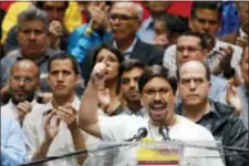  ?? ARIANA CUBILLOS — THE ASSOCIATED PRESS ?? National Assembly first Vice President Freddy Guevara speaks to the press accompanie­d by fellow lawmakers in Caracas, Venezuela, Monday. Venezuelan opposition leaders called Monday for escalated street protests after more than 7 million people rejected...