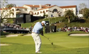  ?? RYAN KANG — THE ASSOCIATED PRESS ?? Bill Haas hits his shot from the rough on the ninth hole during the first round of the Genesis Open at Riviera Country Club Thursday in Los Angeles.