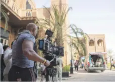  ?? twofour54 ?? On set of ‘Tiger Zinda Hai’ in Kizad. Clockwise from top, Iraq street scene at backlot in Abu Dhabi; star Salman Khan; camera crews prepare for shooting; aerial view of the location