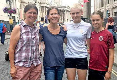  ?? ?? Above, Jo Bellotti and Kate Wilkins with daughters Mils and Isabel, all from Bath, who joined the huge gathering in Trafalgar Square in London, left, to celebrate the Lionesses’ Euros victory