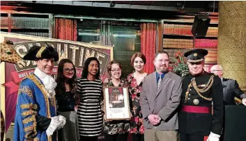  ?? [PHOTO PROVIDED BY MIKE LOWERY] ?? London reception: Westminste­r Lord Mayor Ian Adams, left, with Edmond Memorial orchestra members Ella Brinkman, Chinomso Ibe, Maggie Foster and Emily Fields, orchestra director David Koehn and Queen’s Deputy Lt. Roger Bramble.