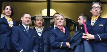  ??  ?? Protest: Former Thomas Cook staff attend hearing in their uniforms yesterday