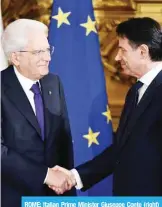  ?? —AFP ?? ROME: Italian Prime Minister Giuseppe Conte (right) shakes hands with President Sergio Mattarella during the swearing in ceremony of the new government at Quirinale Palace on Friday.