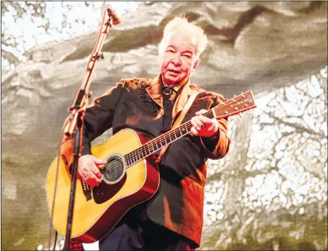  ??  ?? This June 15, 2019 file photo shows John Prine performing at the Bonnaroo Music and Arts Festival in Manchester, Tennessee. Prine died Tuesday, April 7, from
complicati­ons of the coronaviru­s. (AP)