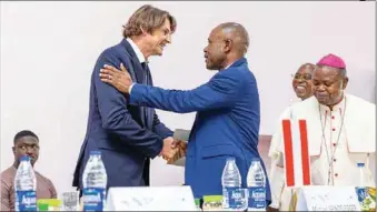  ?? ?? Governorsh­ip candidate of the PDP in Enugu State and CEO of Pinnacle Oil and Gas, Dr. Peter Mbah (Right) in warm handshake with the CEO of Geoffrey Okoye University-European Business Park, Mr. Andreas Gebauer (Left), during the official opening of the Park and the Centre for Practical Skills in Enugu at the weekend, while the Auxiliary Bishop, Catholic Diocese of Enugu, Most Rev. Ernest Obodo, looks on