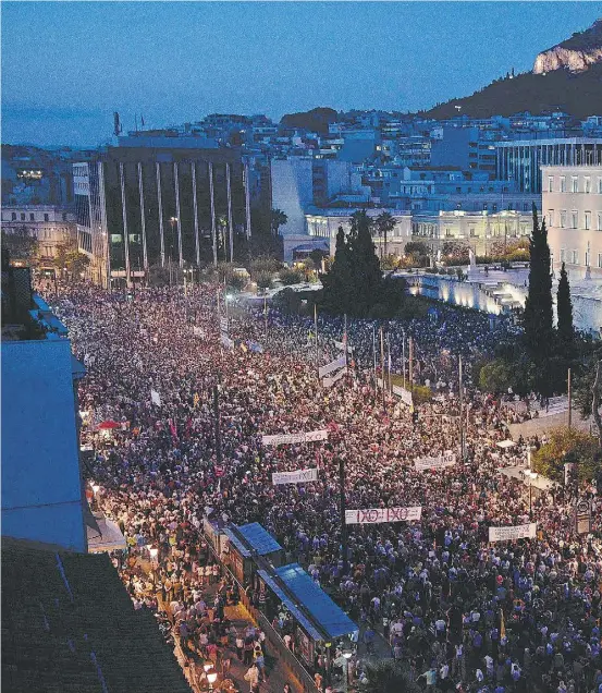  ??  ?? Above: Carrying banners calling for a “no” vote in the referendum on bailout conditions set by the country’s creditors,