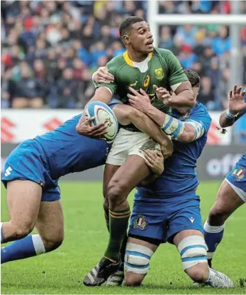  ?? BREGANI / GALLO IMAGES /ROBERTO ?? Damian Willemse of South Africa is tackled by Italy defenders during the Castle Lager Outgoing Tour match at Stadio Luigi Ferraris in Genoa, Italy.