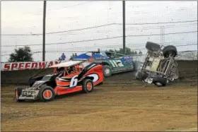  ?? RICK KEPNER - FOR DIGITAL FIRST MEDIA ?? Ron Seltzman (19) gets upside down while racing near Briggs Danner (6) and Kevin Hirthler (117) during Saturday’s action at Grandview Speedway.