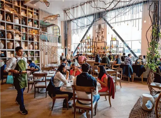 ?? Photos by Adam Pardee/Special to The Chronicle ?? Copra’s aesthetic — equal parts boho chic and hip plant nursery — and scale look more like a grandiose brunch restaurant you might see on the Las Vegas strip.