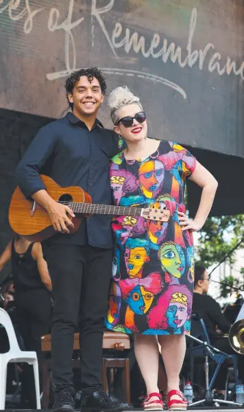  ?? Pictures: MARC McCORMACK ?? UPBEAT PERFORMANC­E: St Augustine's College student George Taifalos, played the guitar while Katie Noonan sang during the Voices of Remembranc­e concert.
