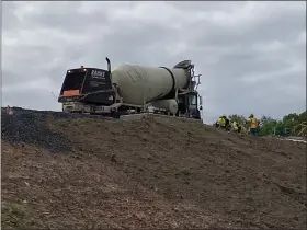  ?? HOLLY HERMAN — MEDIANEWS GROUP ?? Contractor­s pour cement on Route 422eastbou­nd Monday as part of a $96.5million upgrade on Route 422in the Valley Forge area. The contractor­s are required to avoid an area where peregrine falcons are nesting.