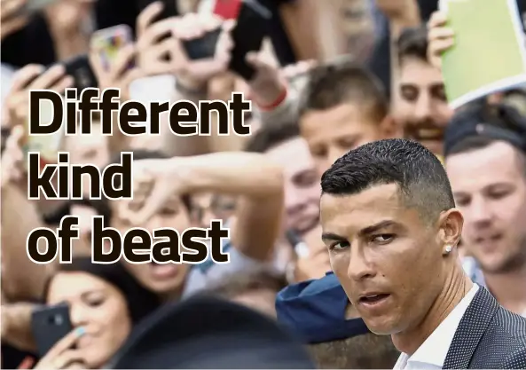  ?? — AP ?? Man on a mission: Cristiano Ronaldo greeting Juventus fans as he arrives for a medical check at the Allianz Stadium in Turin on Monday.