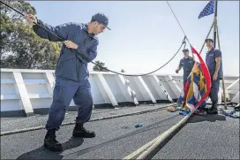  ?? ANDREW BURTON / THE NEW YORK TIMES ?? Crew members preparing for a change of command aboard the U.S. Coast Guard cutter Stratton in Alameda, Calif. Halting drugs is becoming increasing­ly difficult for the Coast Guard, which has operated with flat budgets.